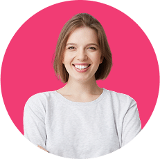 Smiling person with short hair wearing a light gray shirt. Pink circular background.